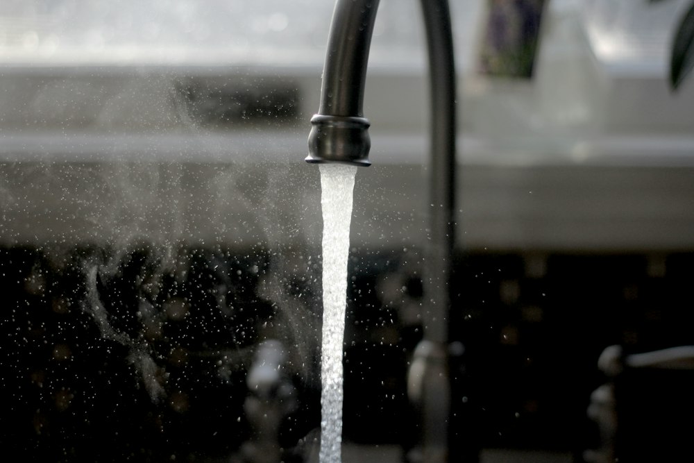 Illustrative kitchen faucet with running water